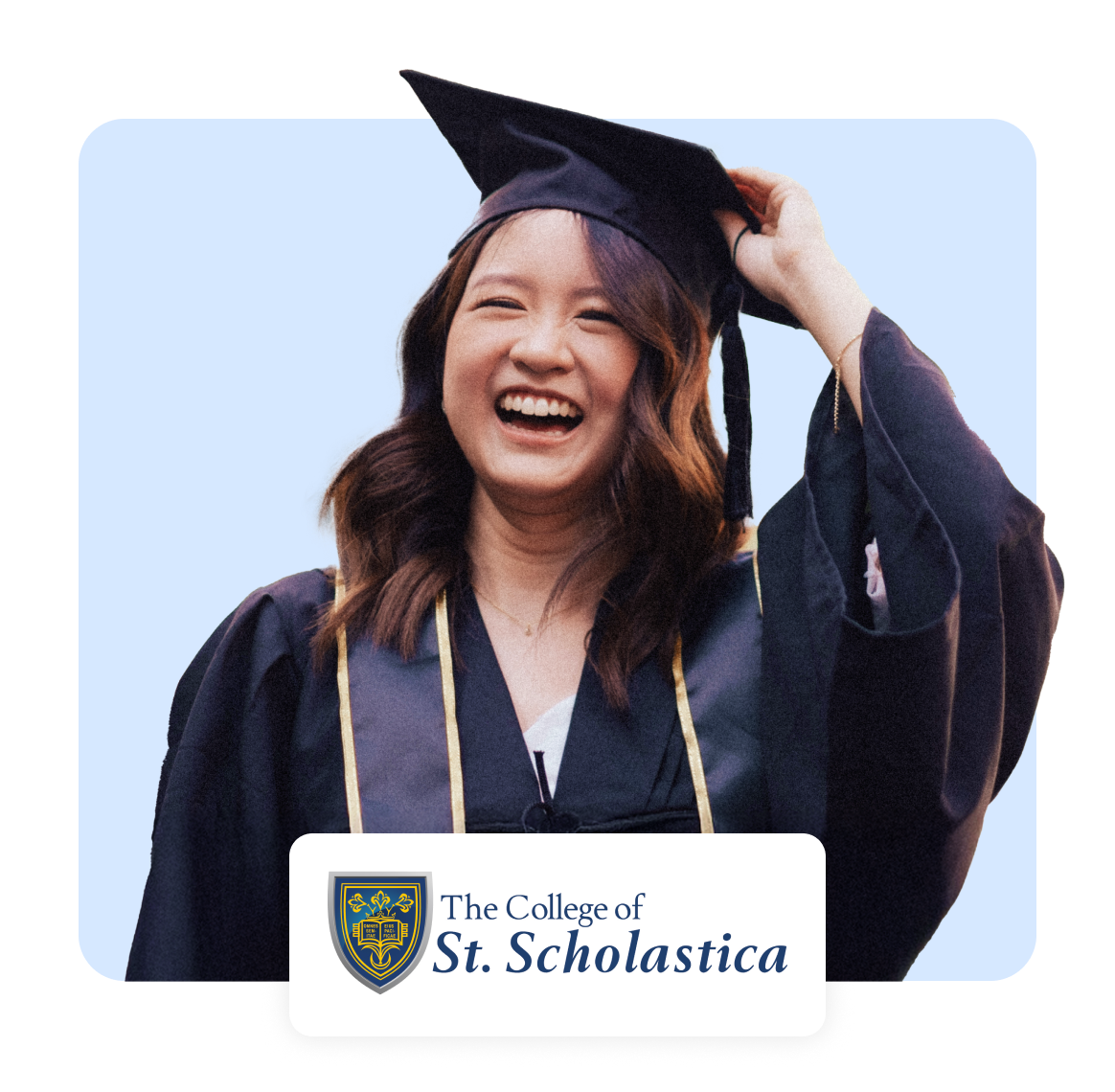 Young woman in graduation cap and gown, smiling joyfully.