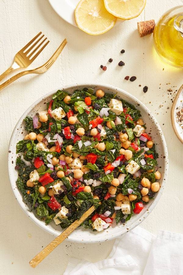 Kale salad with onion, chickpeas, sweet red peppers, feta cheese and a homemade vinaigrette