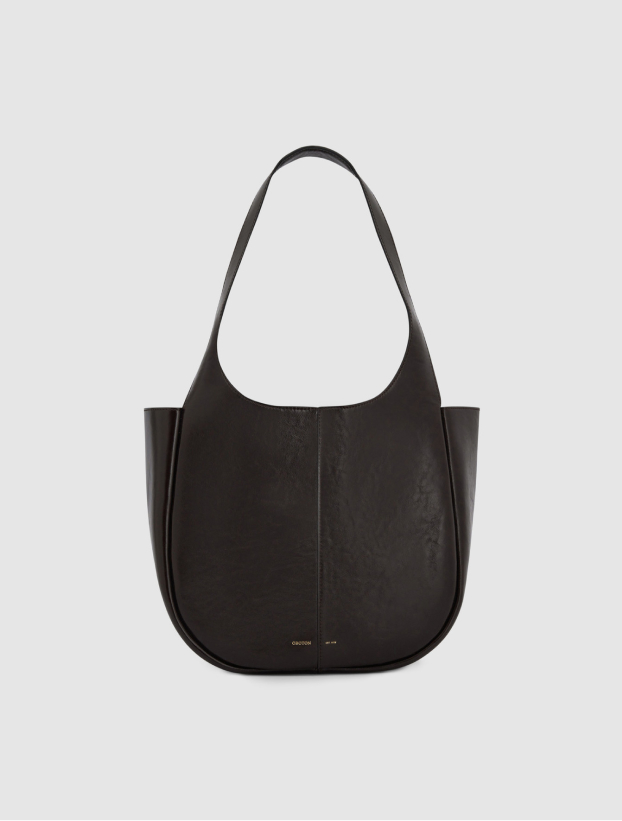 Black leather shoulder bag with a curved design and long strap.