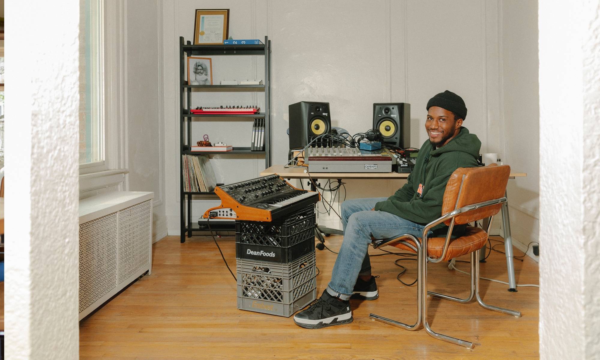 Jay Daniel musician in his studio in Detroit with a Floyd shelf.