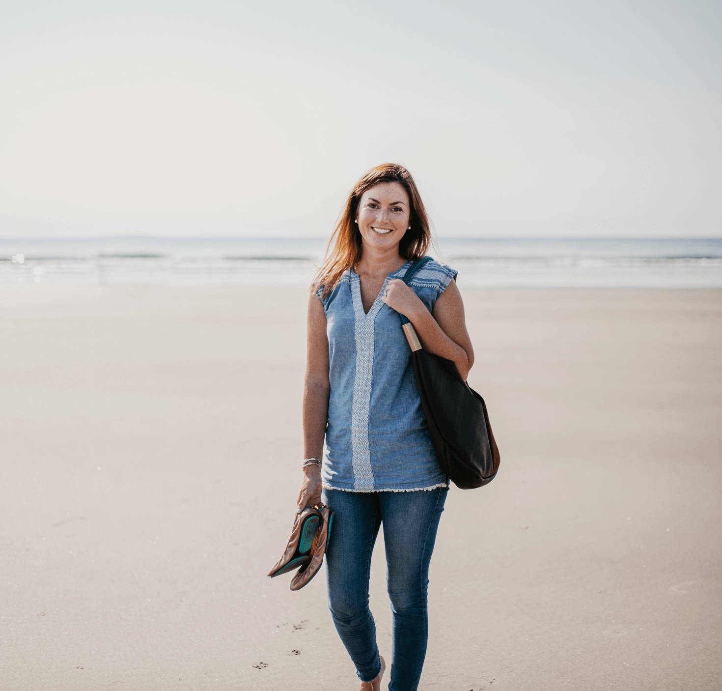 Becky McKinnell with Wildwood Oyster Co. Brown Leather Tote on the Beach
