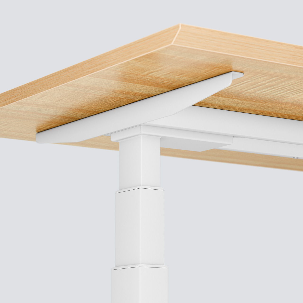 Un bord vu d'en bas de la table de bureau à hauteur réglable électriquement Elevate , dans la couleur 