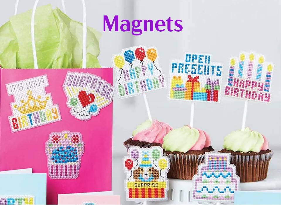 Text: Magnets. Image: Herrschners Birthday Bash Motifs Counted Cross-Stitch Kit.