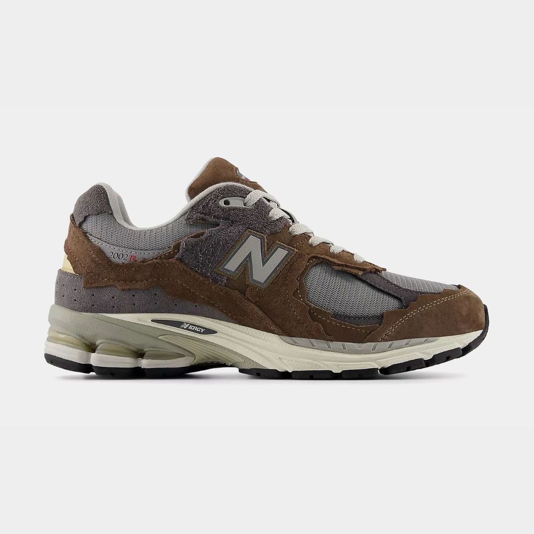 Brown and gray New Balance sneaker on a white background.