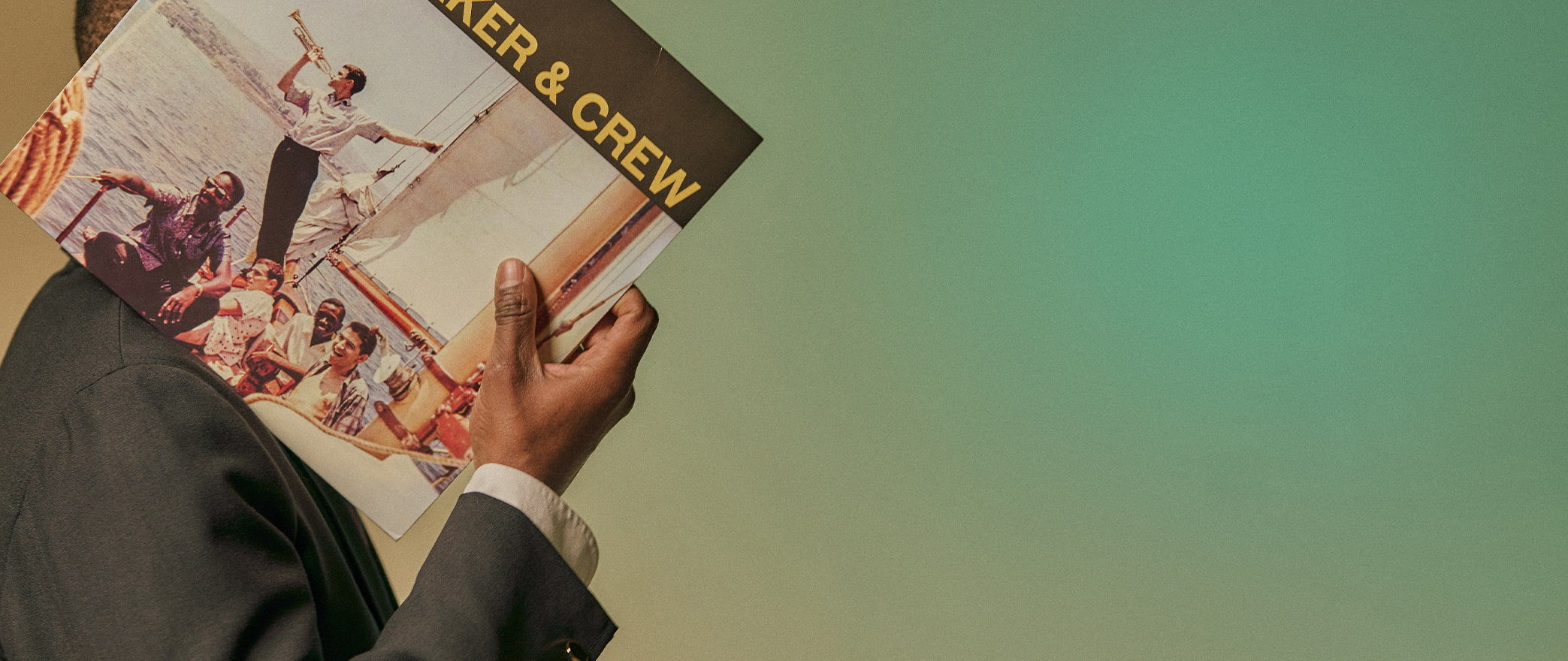 Person holding a magazine with a colorful background.