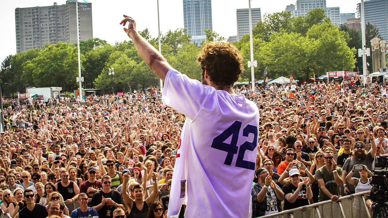 Singer looking at crowd at music festival