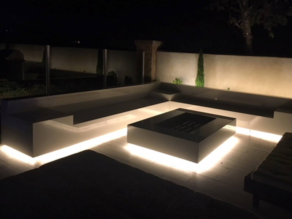 Luxury backyard fire pit with LED strip lights