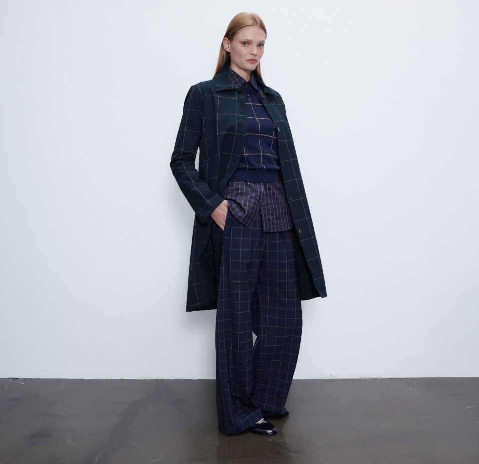 Woman standing with hand in pocket