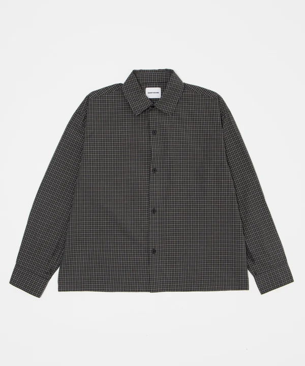 Black and gray checkered button-up shirt on a white background.