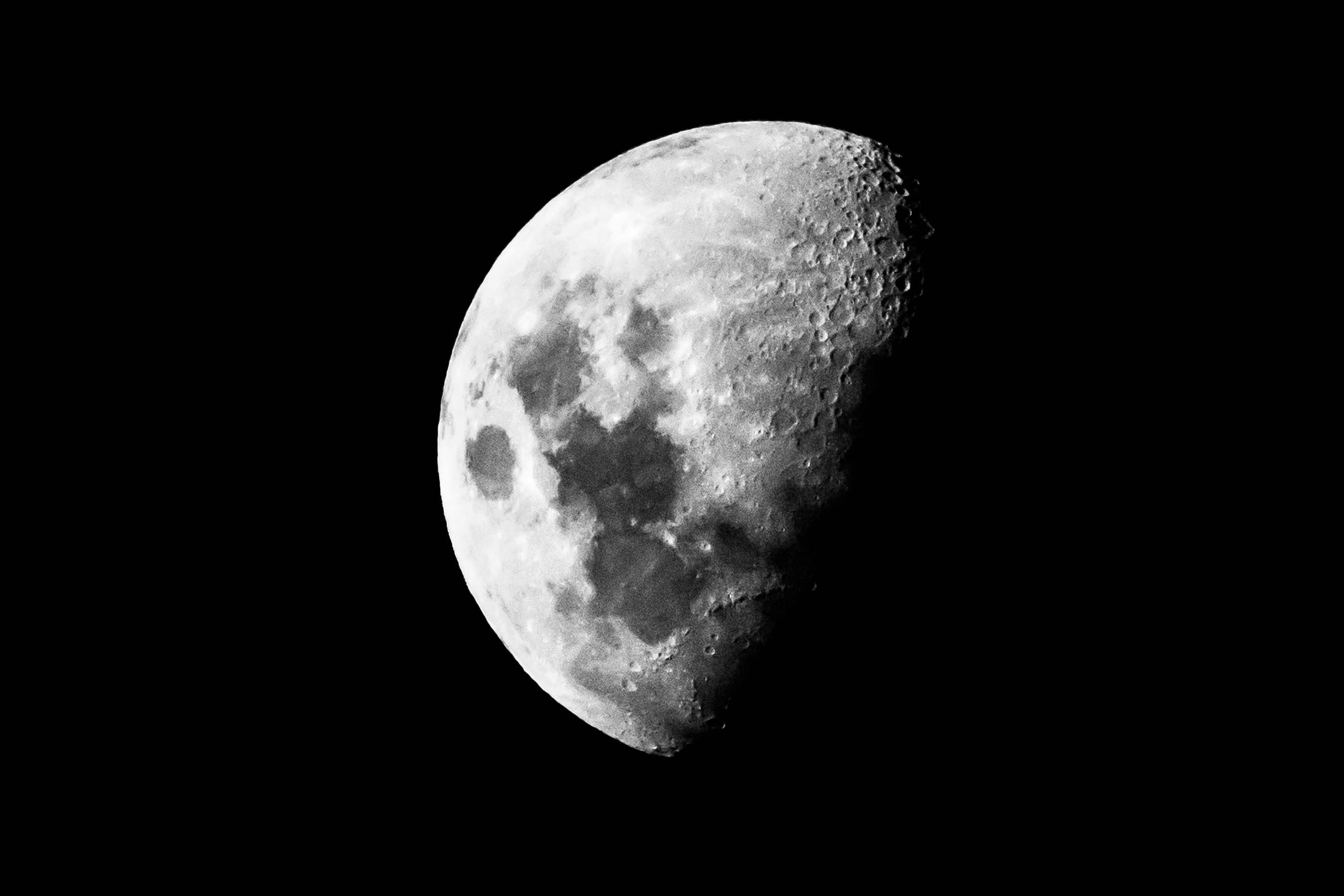 Black and white photo of the Moon. 