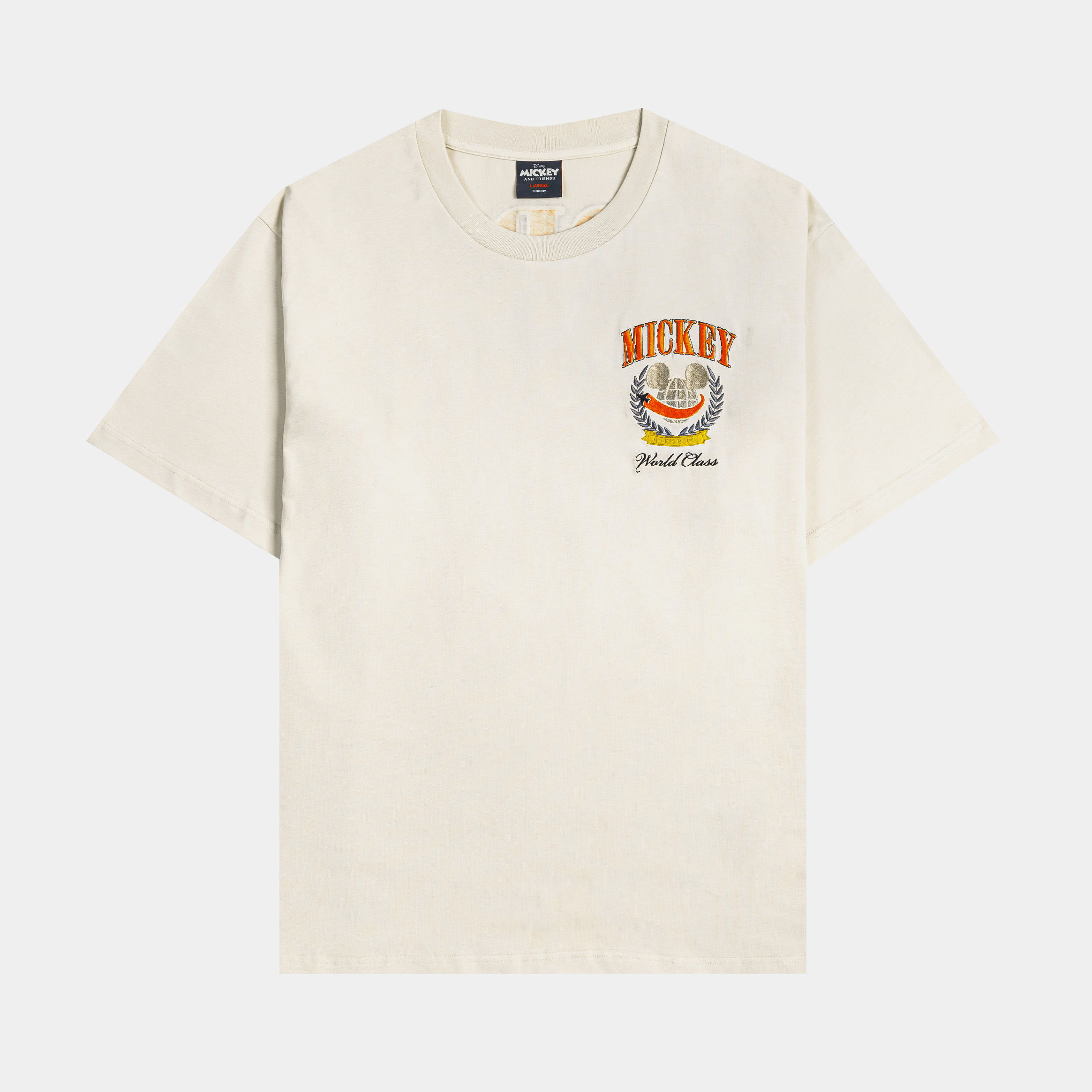 Beige t-shirt with a colorful graphic print on the front.