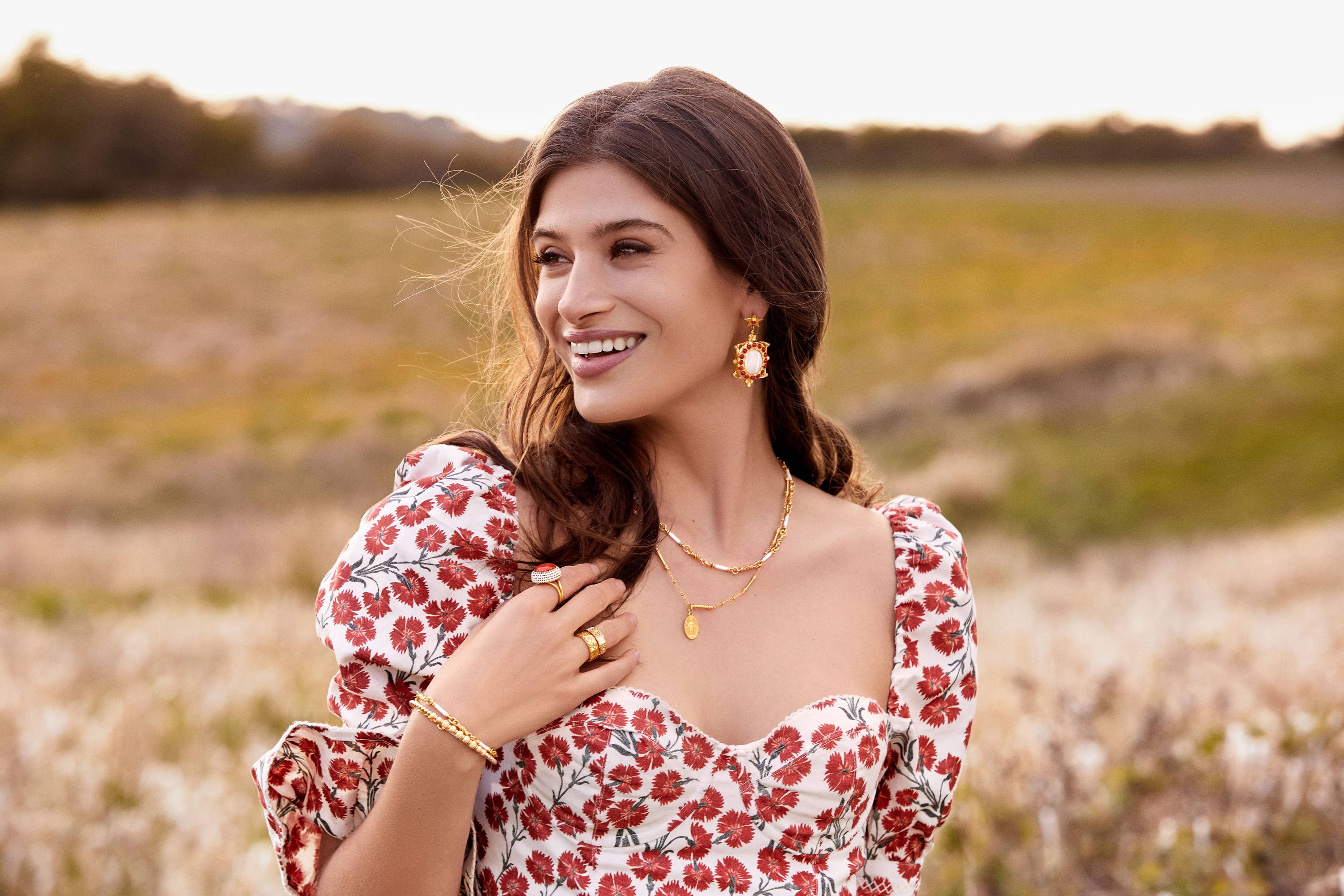 Cairo wears the Mother of Pearl and Coral Earrings, Lavinia Necklace, Mini Pellegrino Necklace, Lavinia Bracelet, Graziella Bracelet, Laurel Ring, White Tullia Ring and Coral Ring