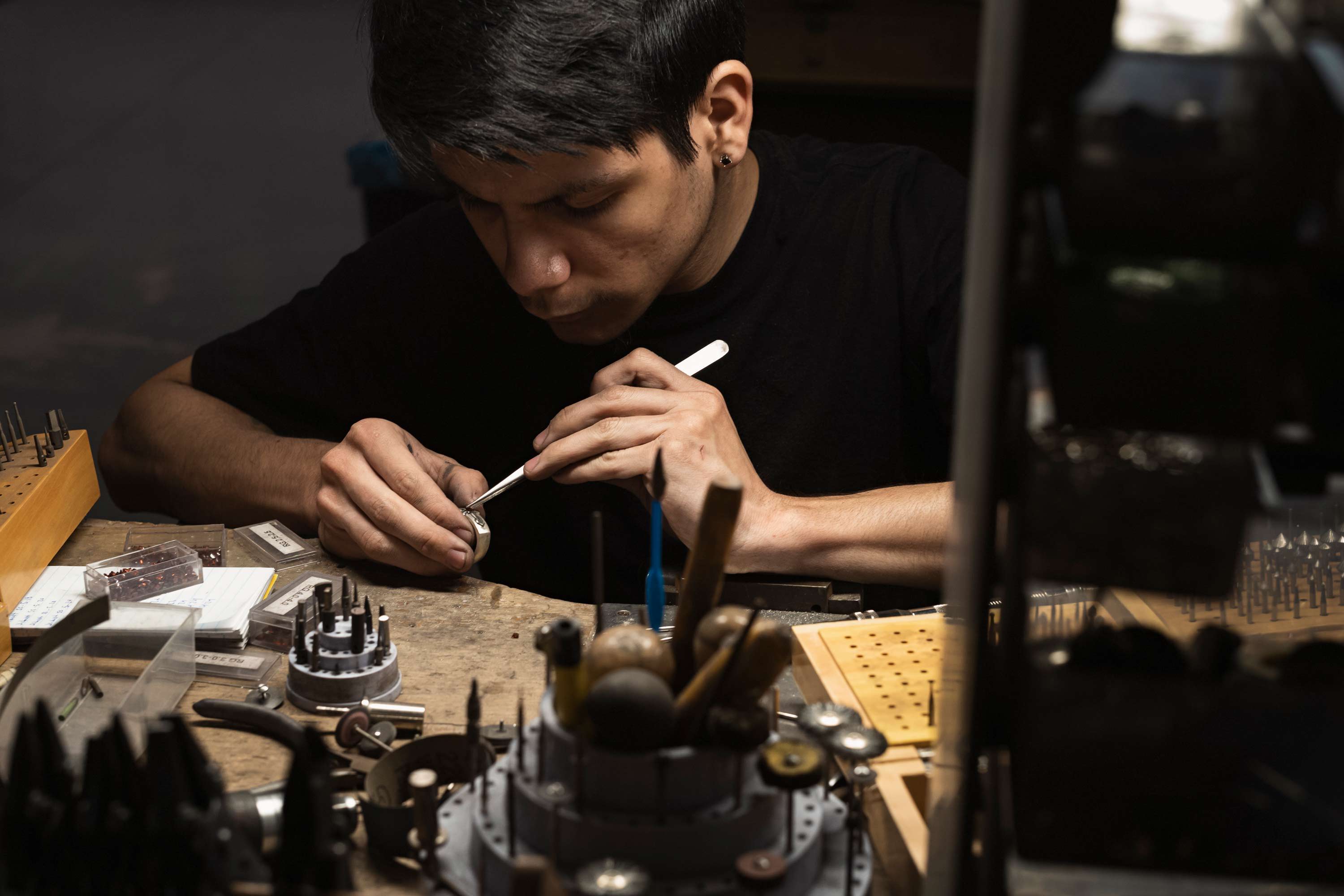 A NightRider Master Jeweler at his bench, handcrafting a ring