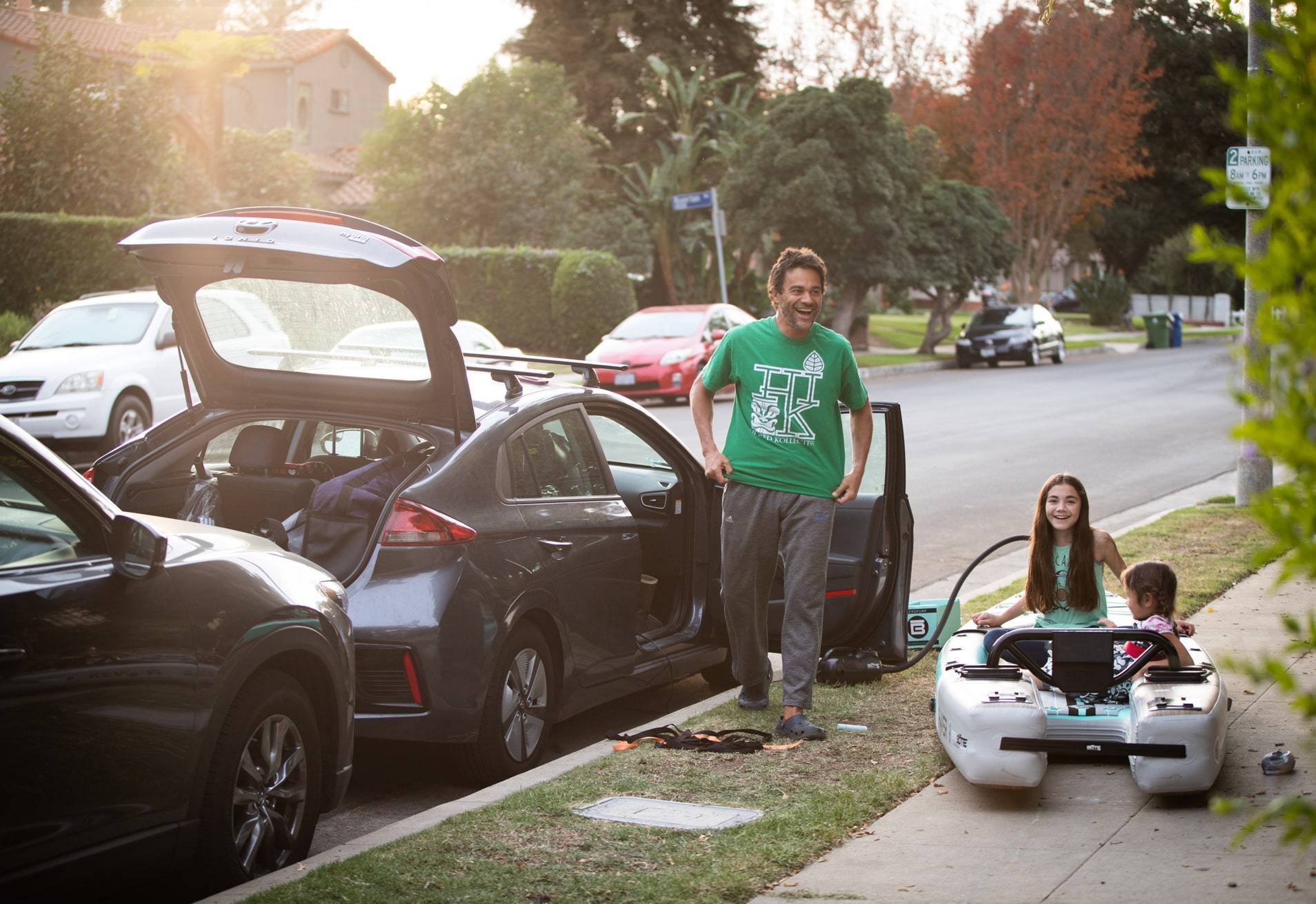 Taloa inflating Rover Aero by his car