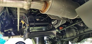 Air compressor, air tank, and train horns installed under the chassis of Ryan's Dodge Ram 1500