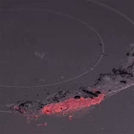 cleaning heaving burned-on residue on glass oven top 