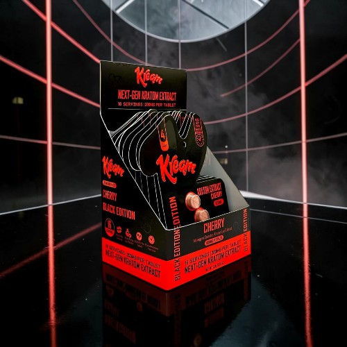 Black and red product box with branding and promotional text, set in a futuristic background.