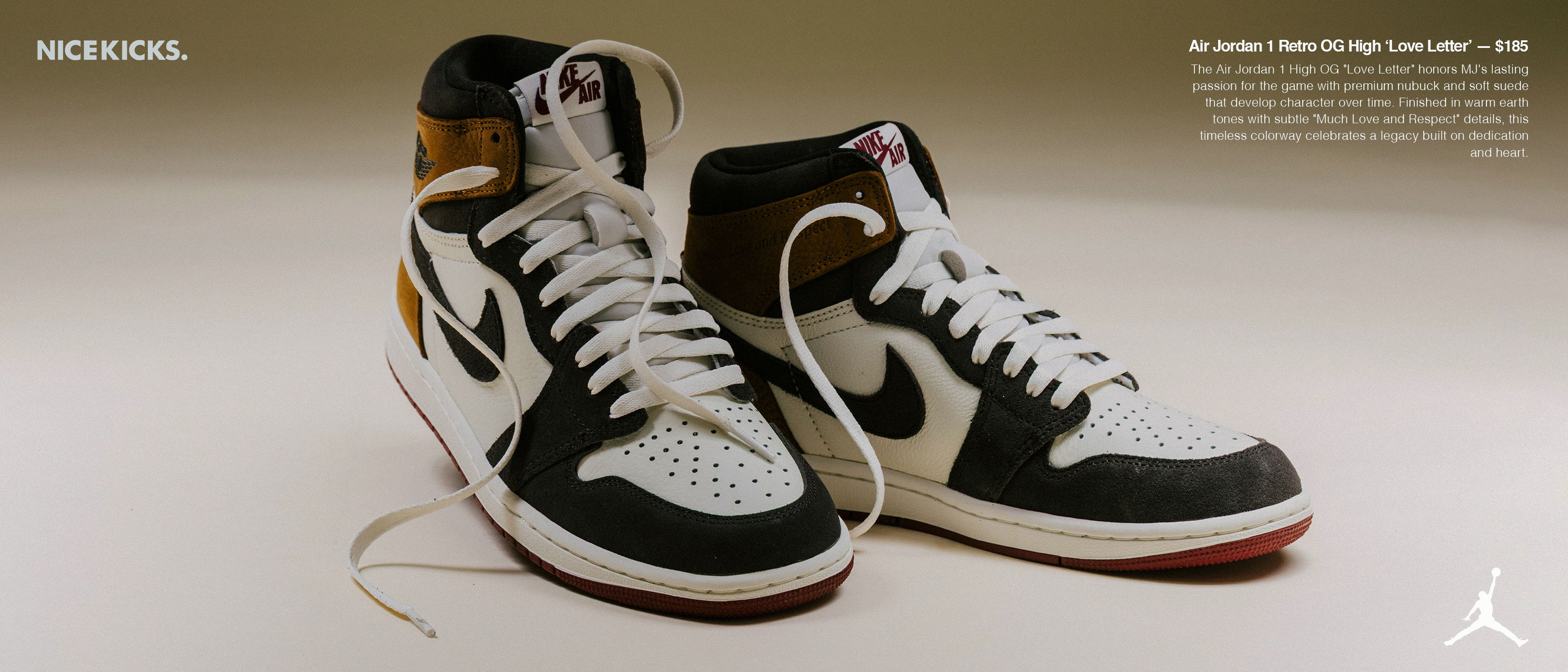 Black and white high-top sneakers with red accents on a neutral background.