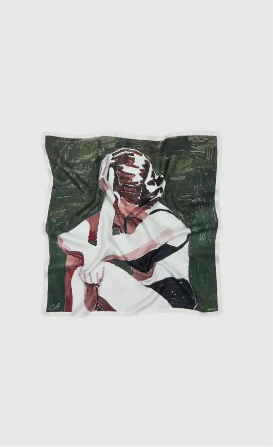 A wrinkled fabric featuring an abstract figure design in muted colors.