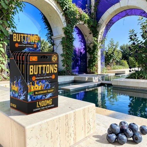 Boxes of buttons near a pool and grapes in a sunny garden.