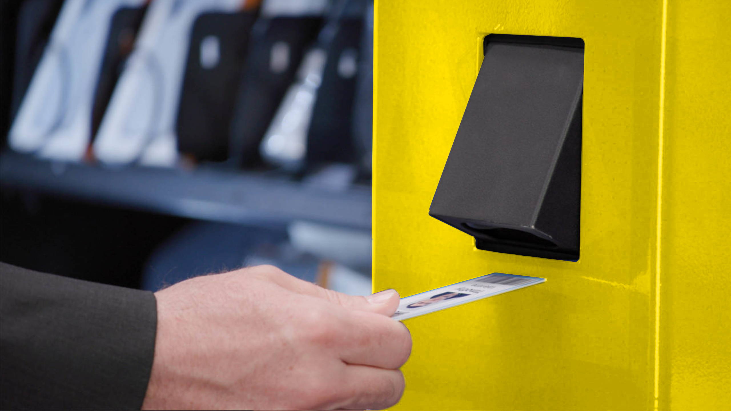 Man using barcode scanner on ppe vending machine.