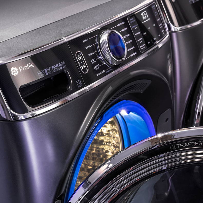 Close up view of the GE Profile Front Load washer with door open, with Microban Technology