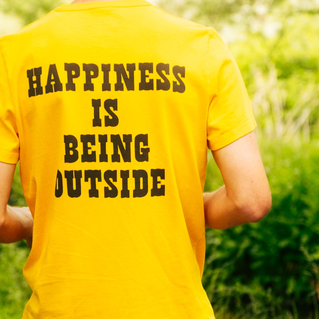 Person wearing a yellow shirt with 
