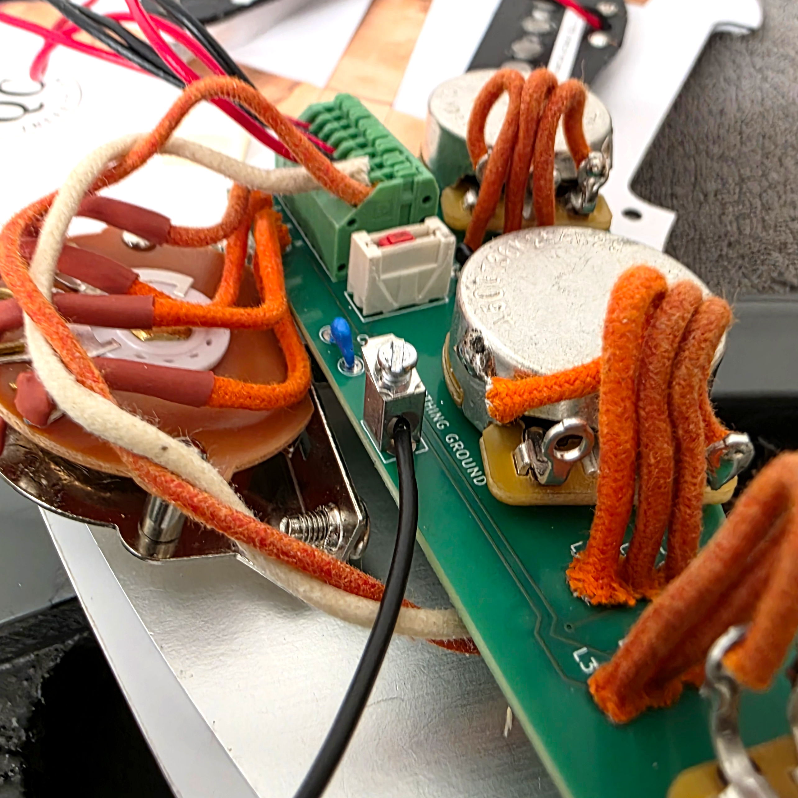 Close-up of a circuit board with wires and components.