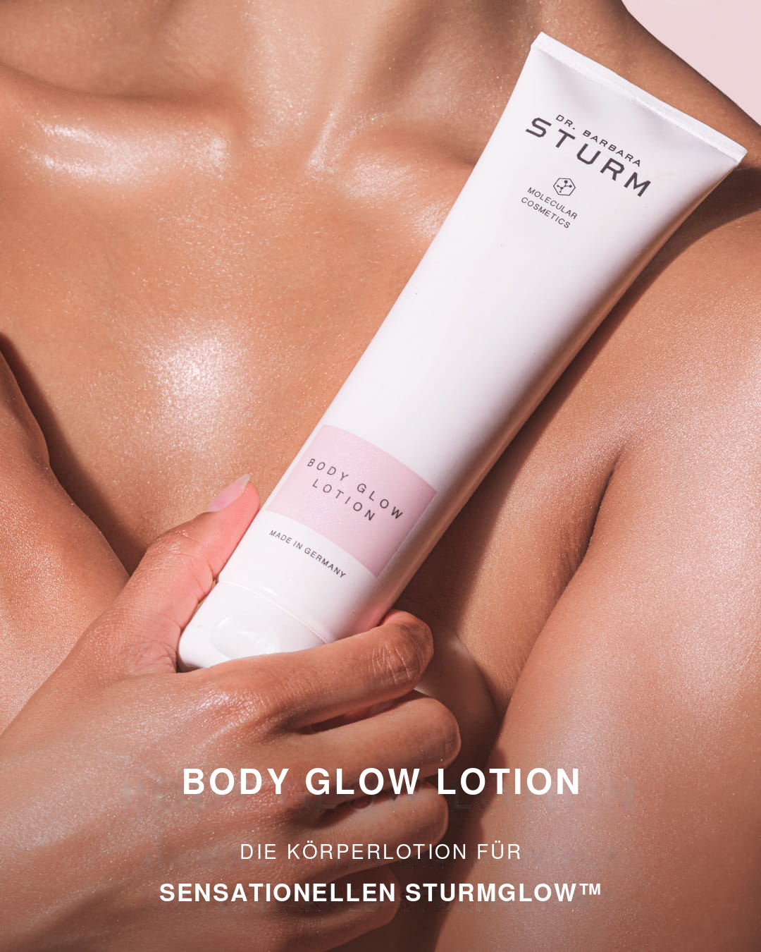 Person holding a body glow lotion tube with a glossy skin appearance.