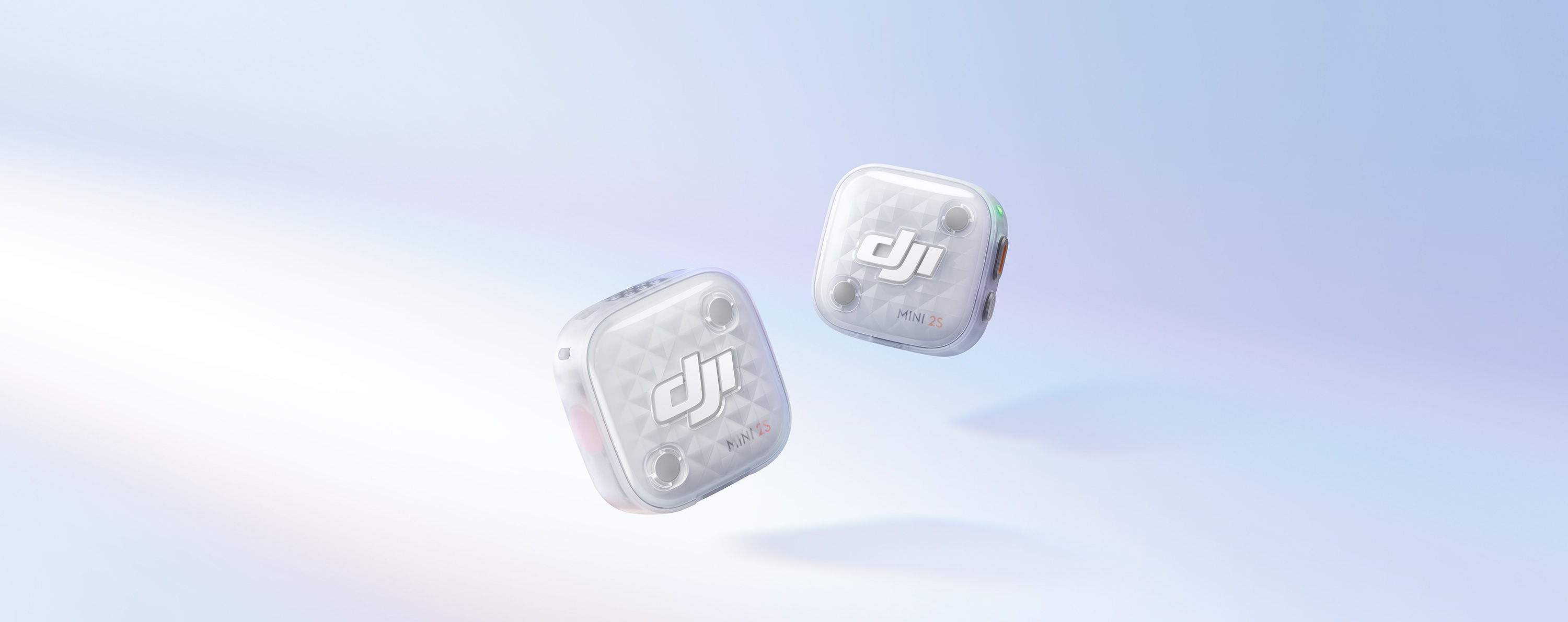 Two DJI Mic Mini 2S floating against a soft blue gradient background.