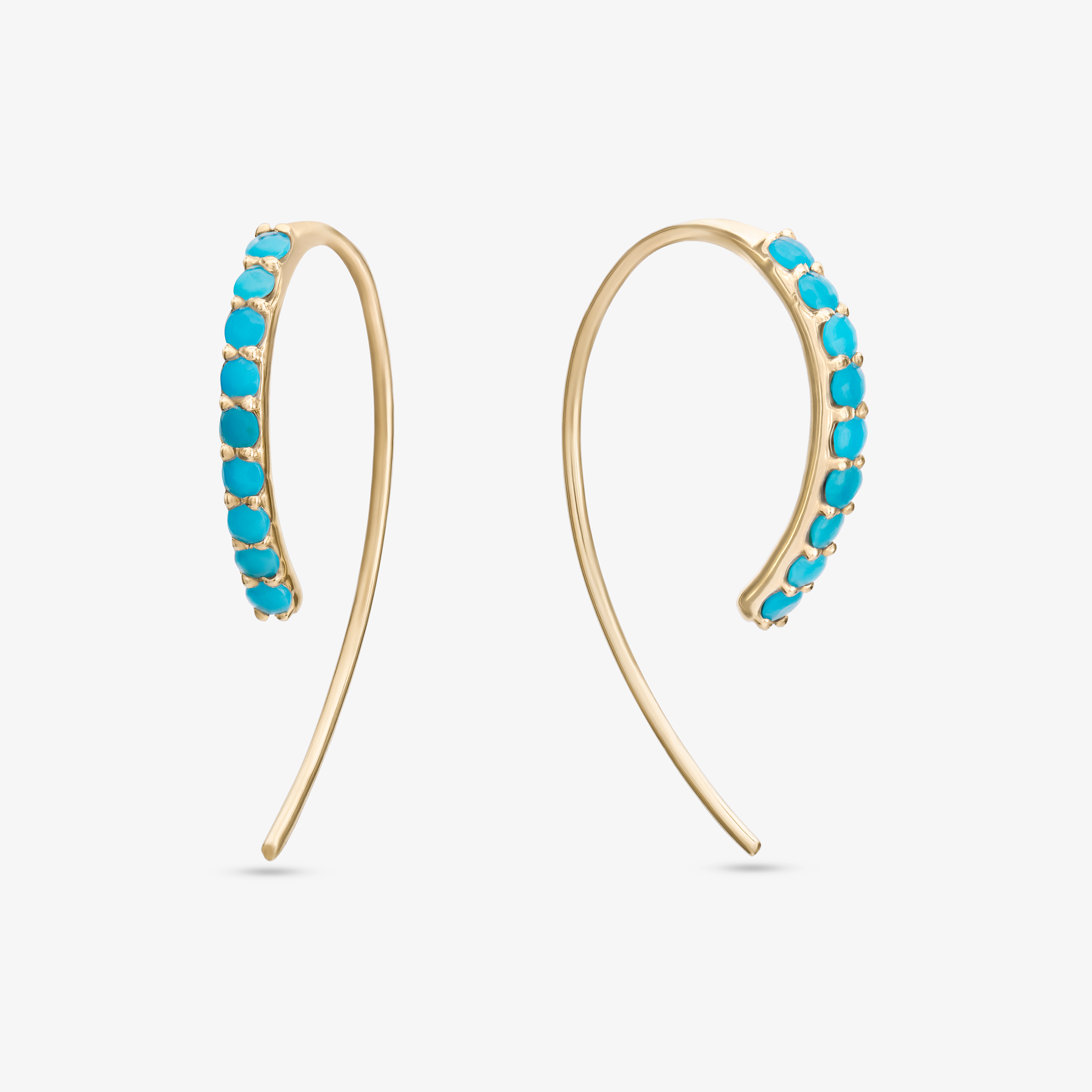 ellow gold ear climber earrings featuring a row of vibrant turquoise gemstones in a modern curved design.