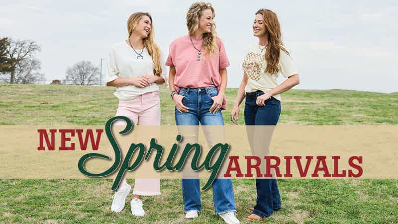Group of women standing in a field wearing spring western apparel