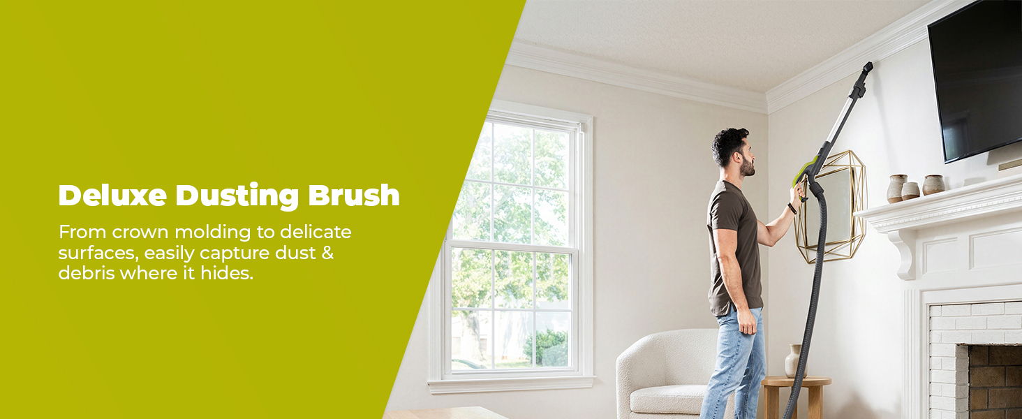Person using a deluxe dusting brush to clean a high wall.