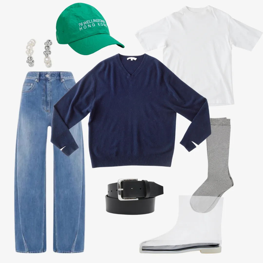 Flat lay of casual clothing and accessories, including a hat and shoes.