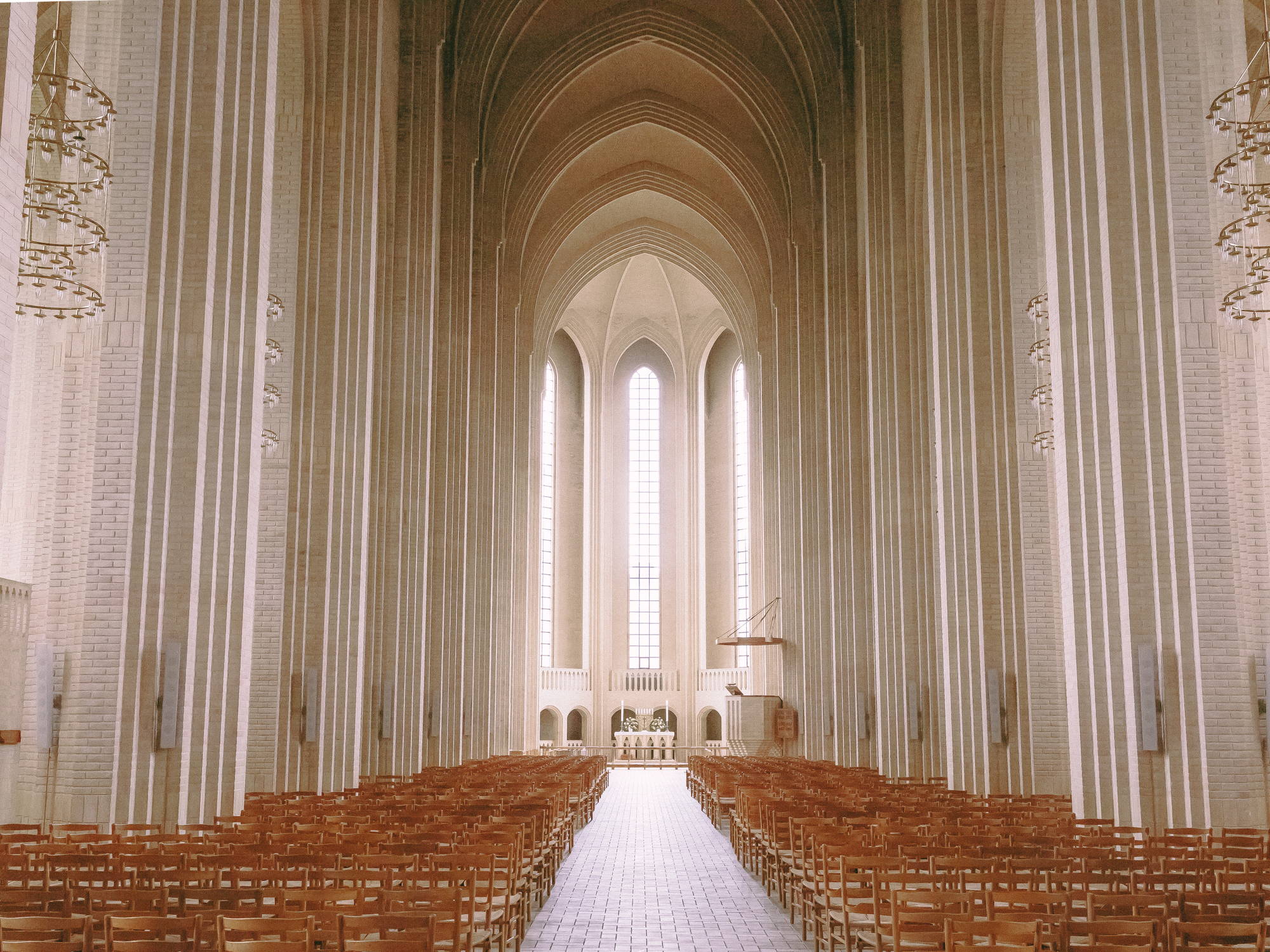 Cathedral with wooden chairs and big windows