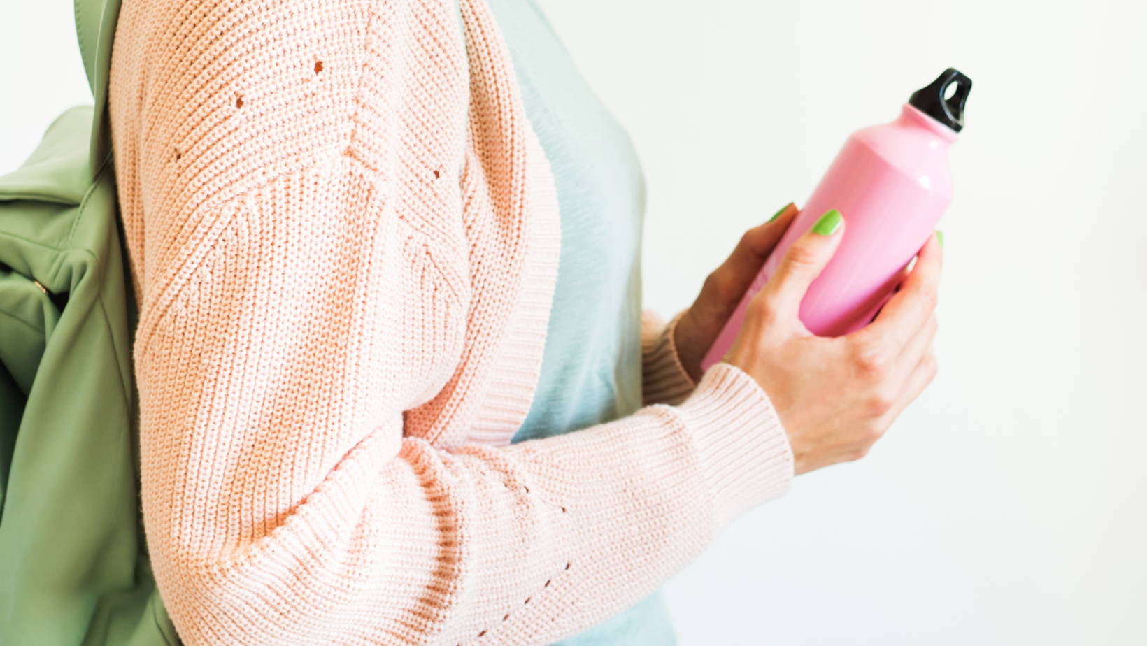 person holding water bottle