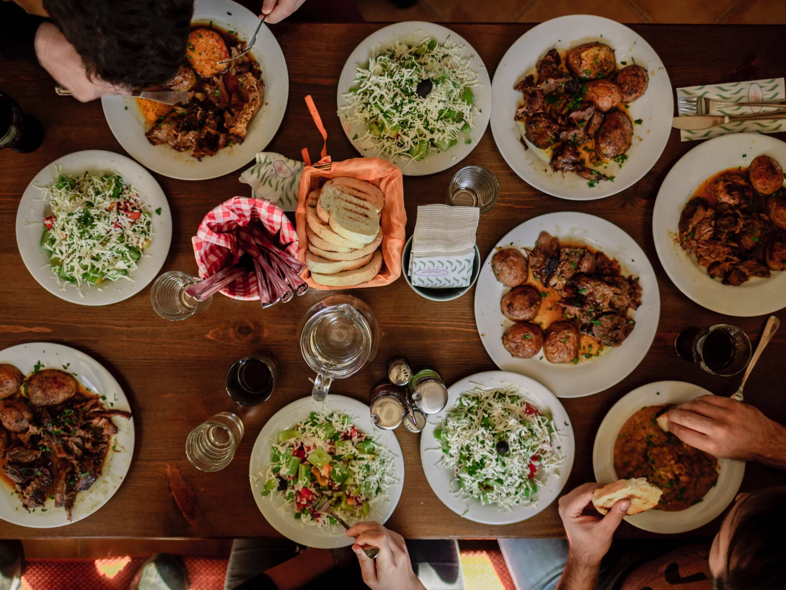 Overhead shot of people eating around a table