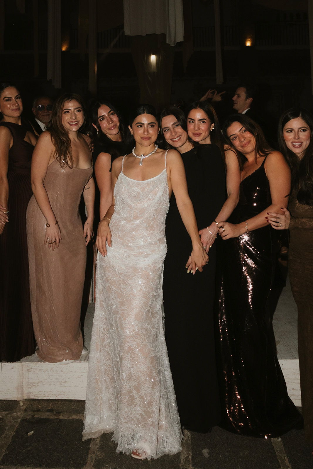 Bride with her bridal party celebrating in a sequin wedding dress