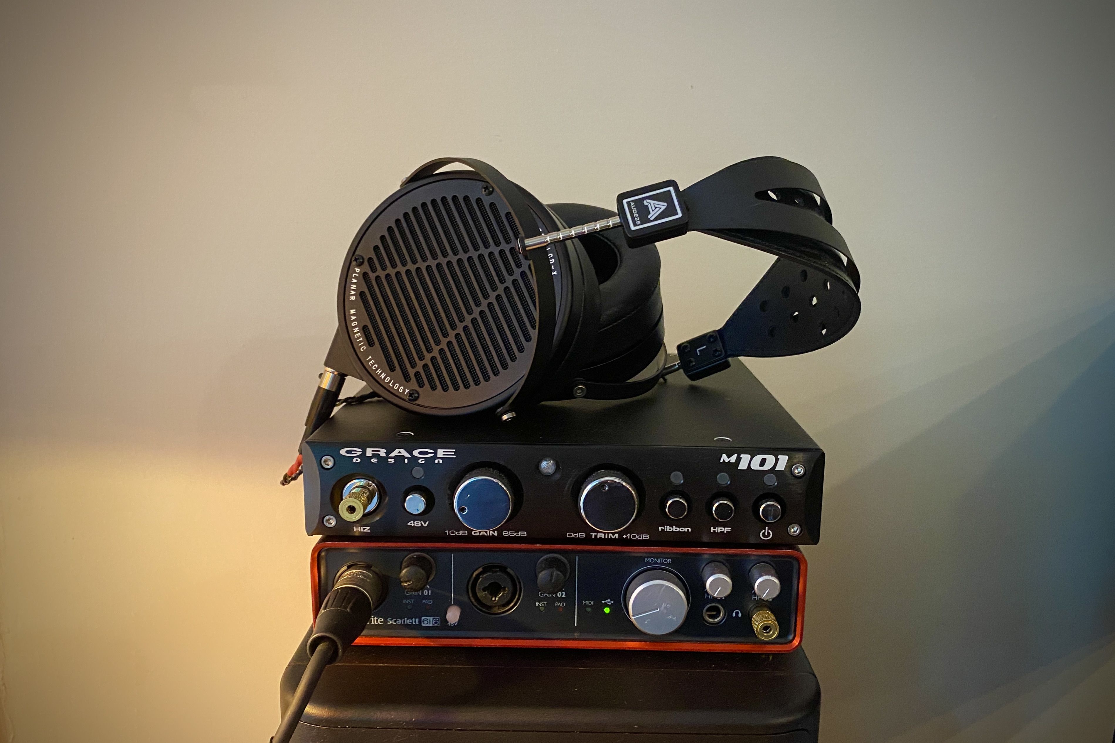 Audeze LCD-X headphones on top of a DAC/ AMP stack set up