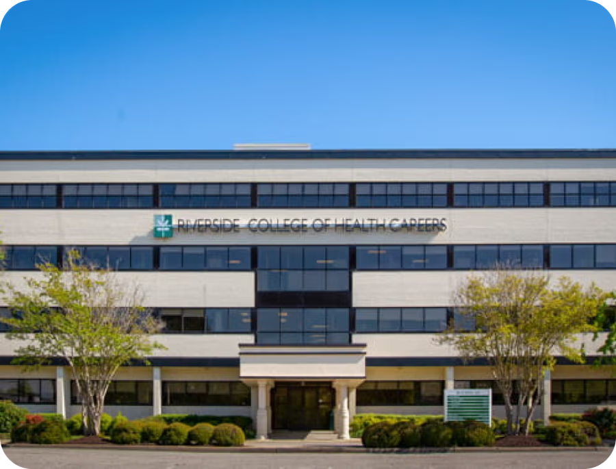 Building exterior with signage for a health organization against a clear blue sky.