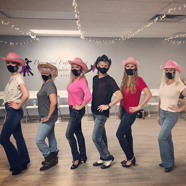 Dance group wearing matching face masks