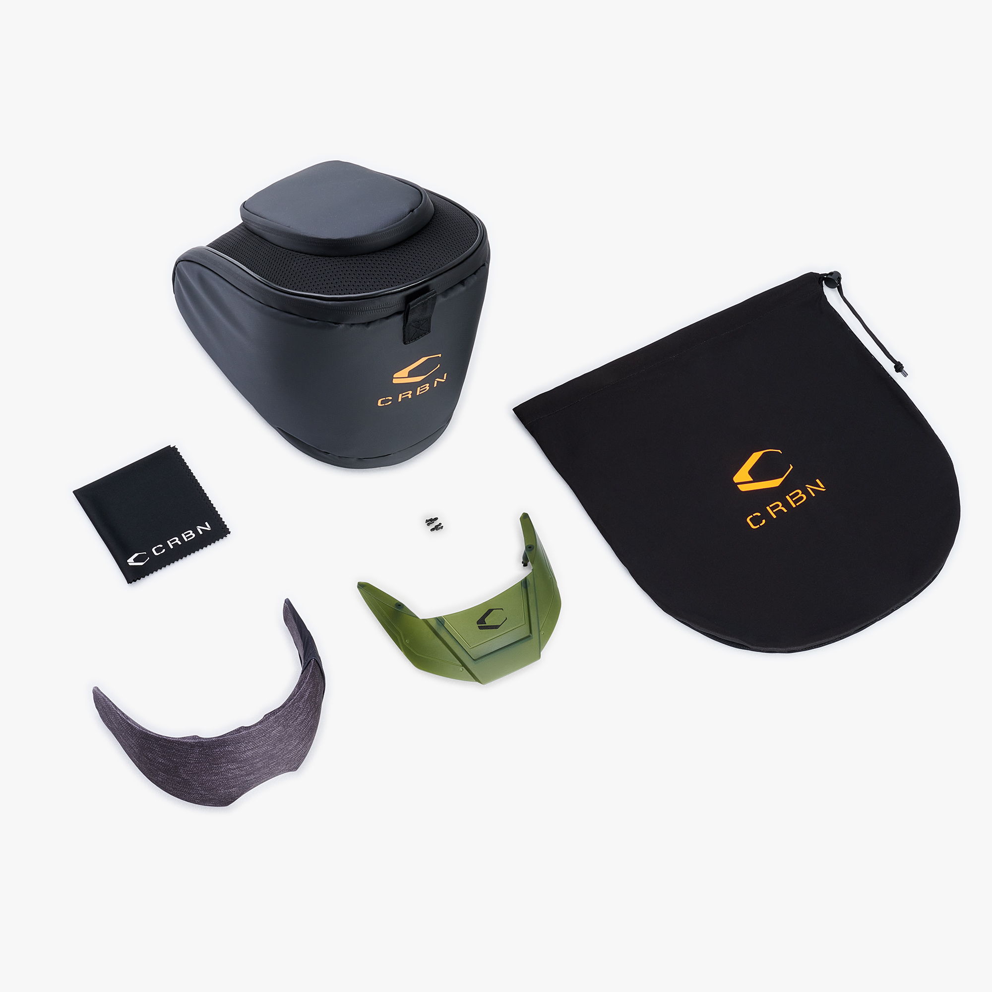 Collection of zero goggle accessories including a case, visor, and an extra lens.