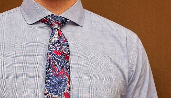 Man wearing a blue and red paisley tie