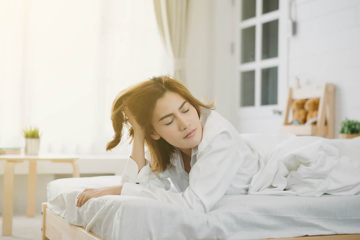 Person laying on mattress