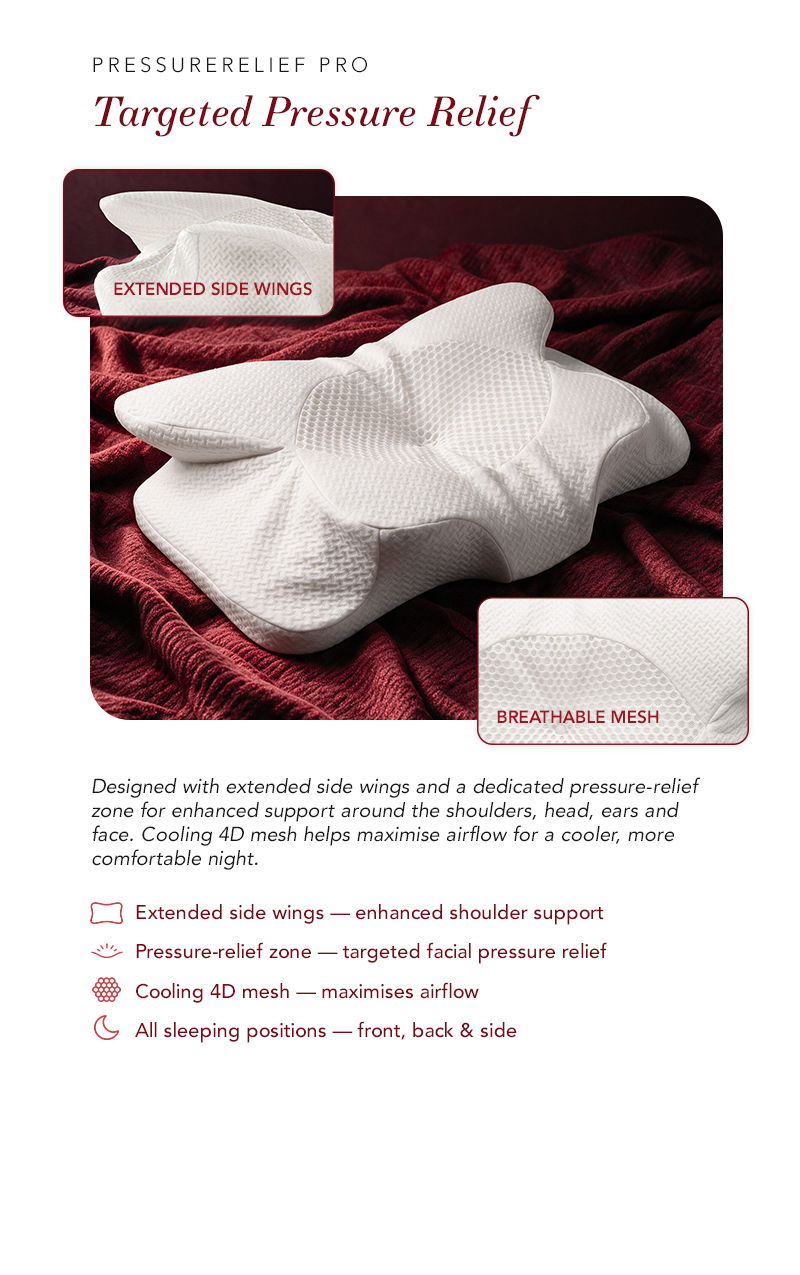 White pillow with extended side wings on a red background.