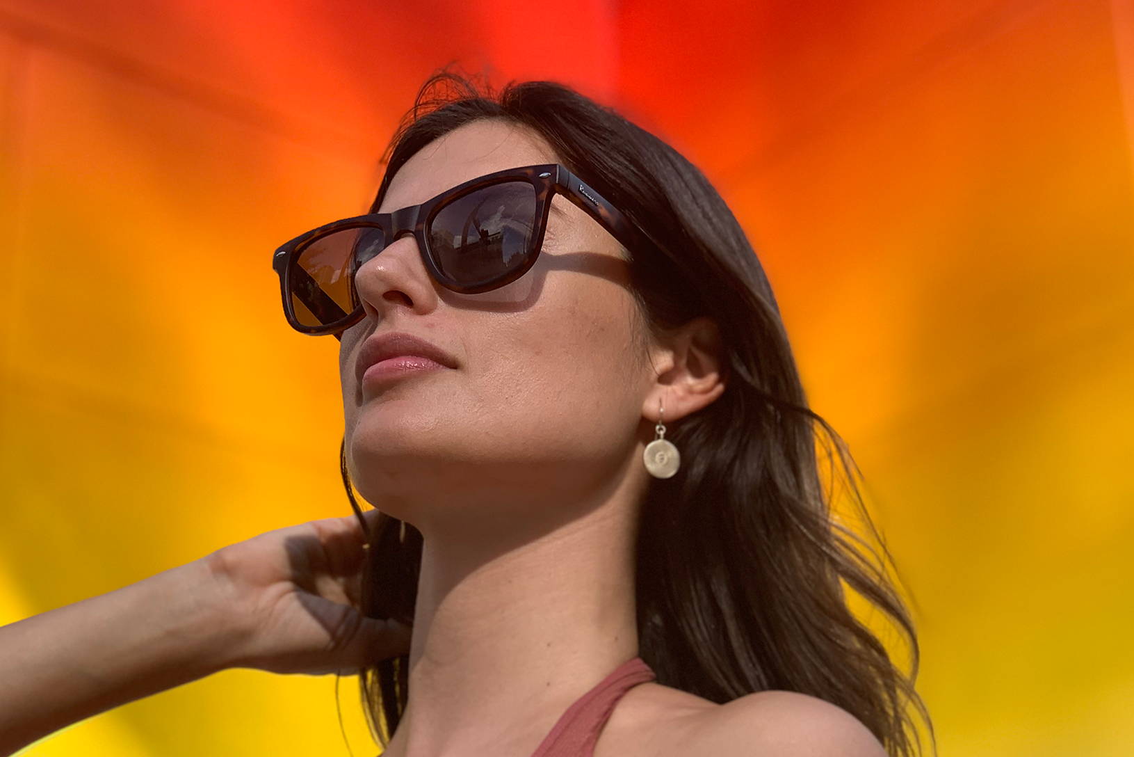 Woman wearing tortoiseshell sunglasses