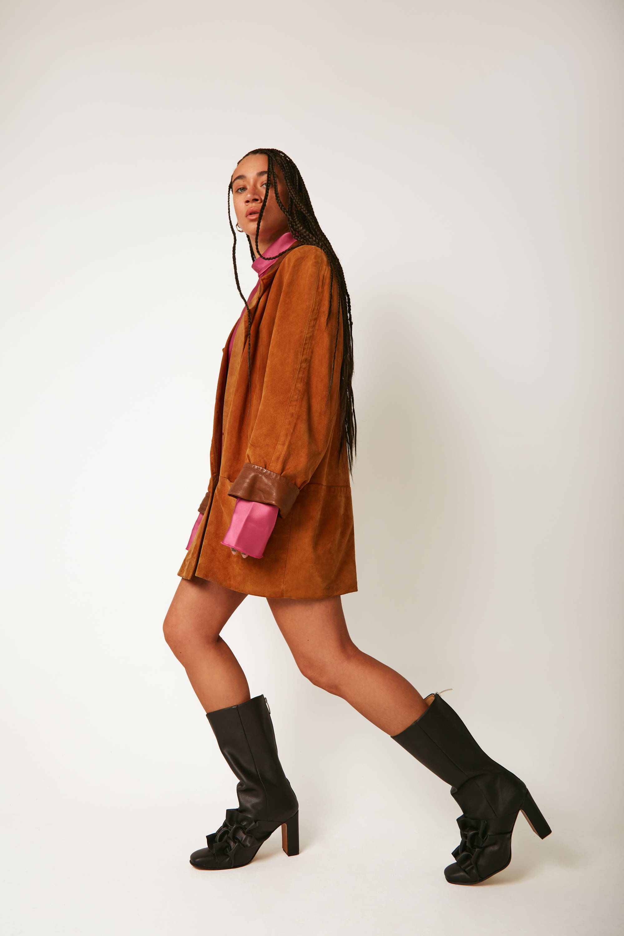 Vandrelaar black Greta high-heel vegan ankle boot on model wearing a brown suede coat