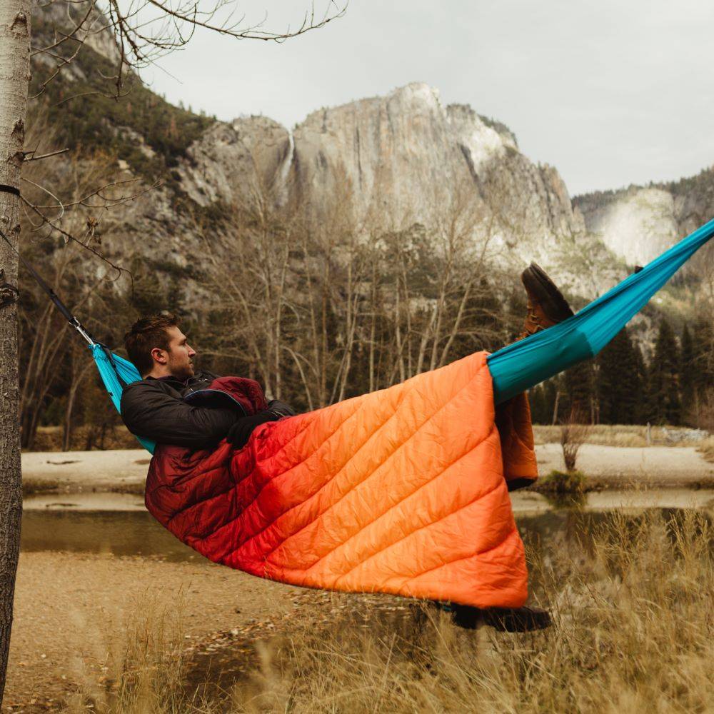 Man in hammock with a blanket