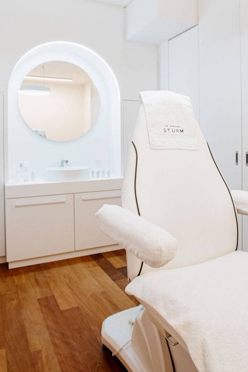 Sturm spa in room with white chair
