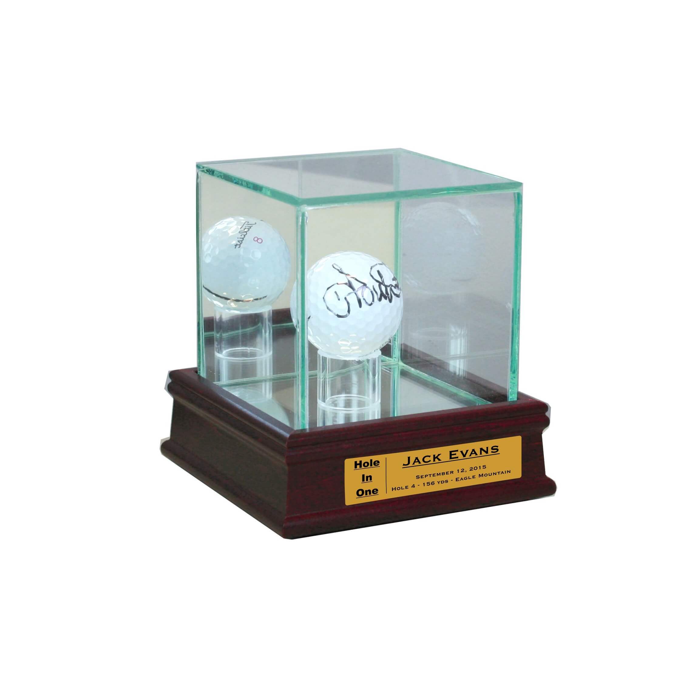 A trophy display case with golf balls and a wooden base.